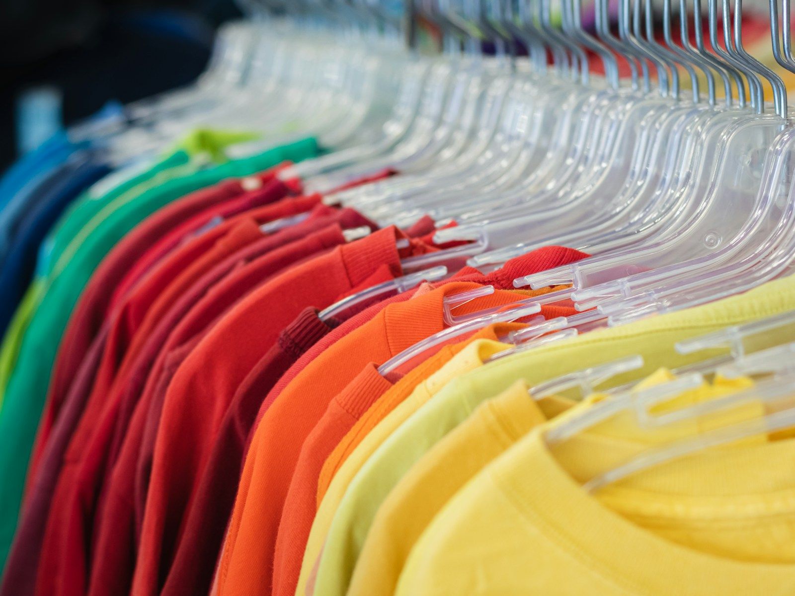Clean shirts hanging in a row on a garment rack